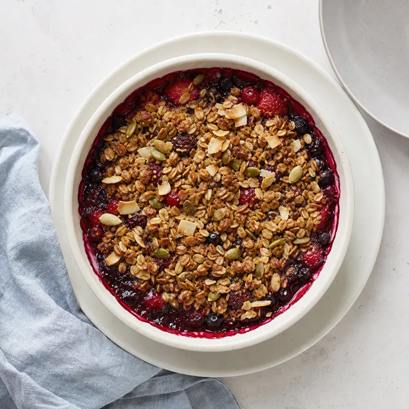 Berry crumble with seed and coconut topping